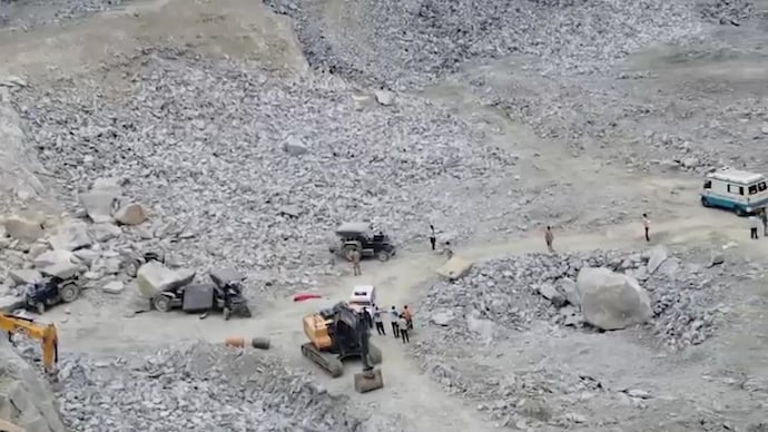 Police said a massive boulder being moved with a tractor crashed onto workers inside the quarry pit.