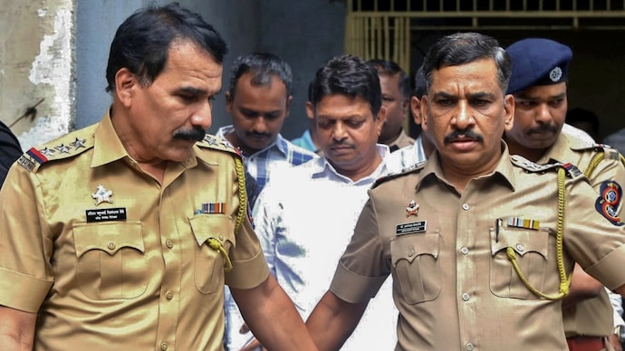 Shiv Sena corporator Ramesh Mhatre being produced before a court in Kalyan. (PTI photo)
