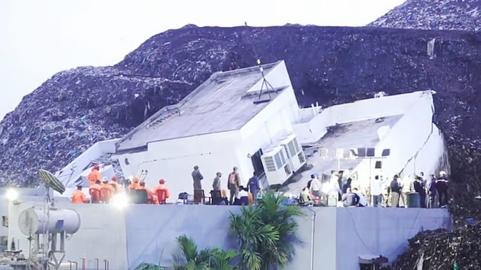 Rescue personnel carry out operations at the site where a three-storey administrative building collapsed at the Pimpri Chinchwad Municipal Corporation's waste-to-energy plant in Moshi following heavy rainfall in Pune. (Photo: PTI)