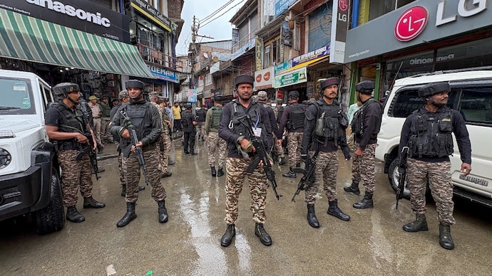 Security personnel conduct a search operation following a terrorist attack in which a police head constable was killed in Anantnag. (Photo: PTI)