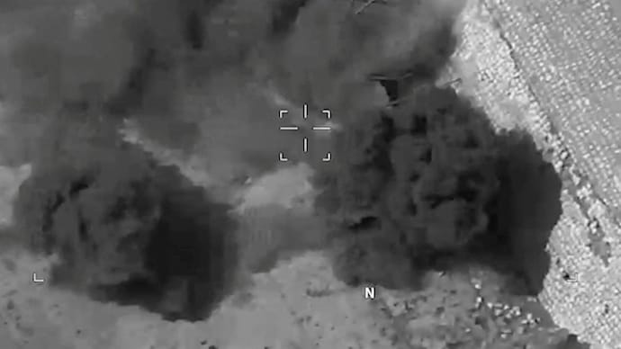 Smoke rises from an explosion at an unknown location, during what US Central Command (CENTCOM) says are strikes on Iran, in this screengrab taken from a handout video released on July 20. (Reuters)