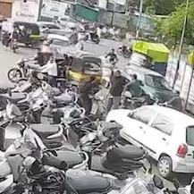 Man grabs estranged wife by hair, punches her on Surat road. CCTV captures attack