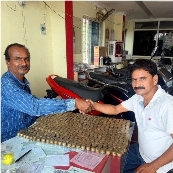 Telangana man walks into showroom with Rs 10 coins, rides out on a new bike