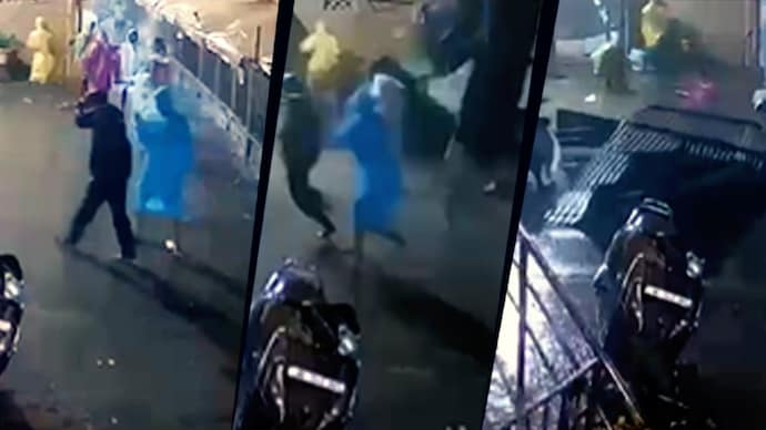 The footage shows the devotees moving slowly along the road as the storm rages around them.