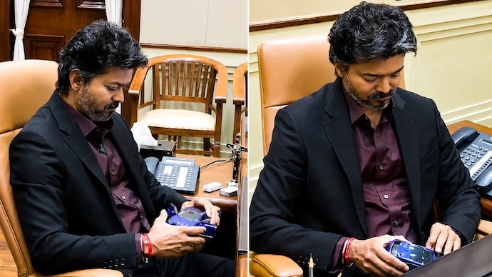CM Vijay was seen playfully fiddling with a miniature car during an official meeting. Vijay's photos