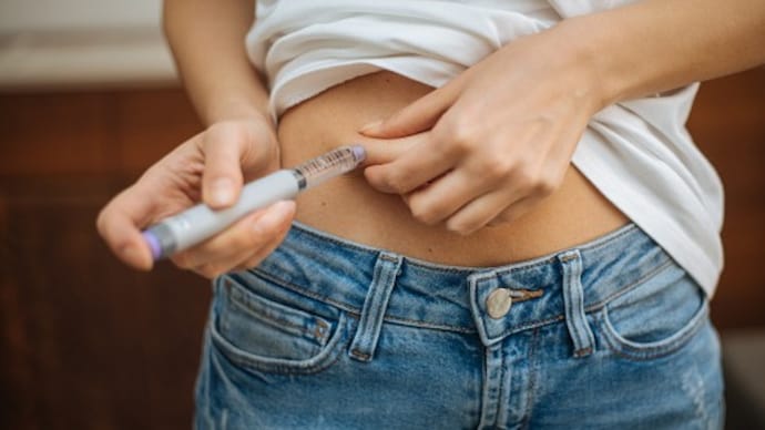 Woman doing insulin injection