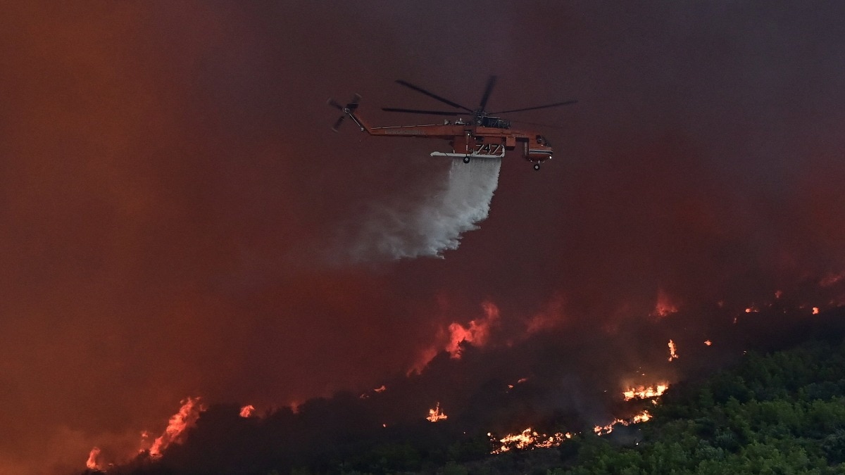 Two firefighting helicopters collide near Athens while battling wildfires; search and rescue underway