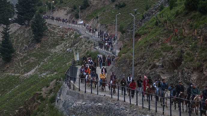 Hindu pilgrims ride horses during their pilgrimage to the cave shrine of Amarnath