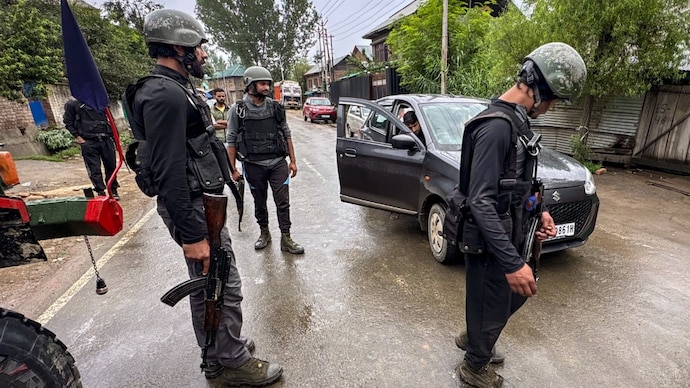 Security personnel conduct a cordon-and-search operation after two labourers from Chhattisgarh were killed in a terrorist attack at a brick kiln in Kulgam district. (PTI photo)