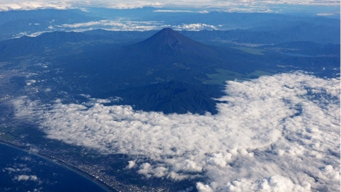 Japan's highest mountain, Mount Fuji, 3,776 metres (12,388 feet), seen from a commercial flight in Japan. ( Photo- Reuters)