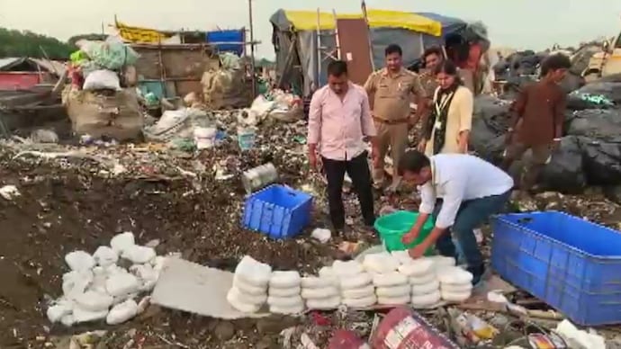 Officials destroy a batch of paneer deemed unsafe in UP's Gautam Buddha Nagar. Paneer destroyed in Noida