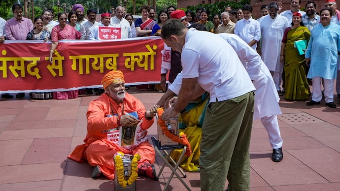 Pappu Yadav, dressed in saffron clothes, performing the skit on Ram Mandire donation theft with other Opposition MPs. (PTI photo)