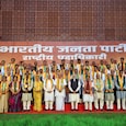 PM Modi with the new BJP team at the national headquarters in New Delhi. PM Modi with the new BJP team at the national headquarters in New Delhi.