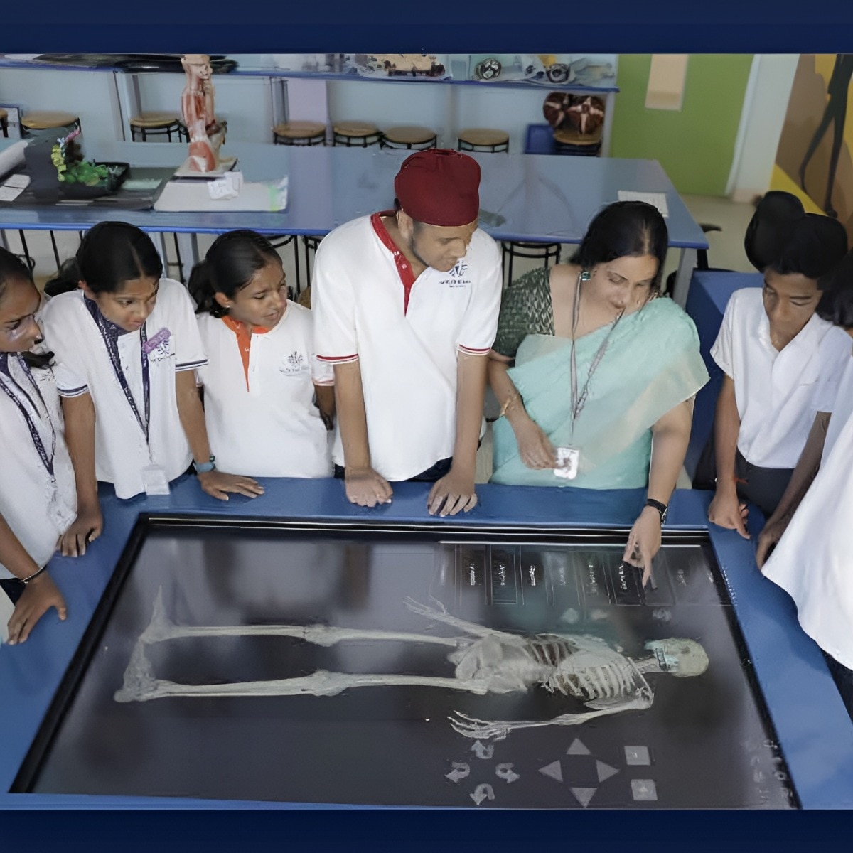 Radha Rajesh with students while teaching using simulations