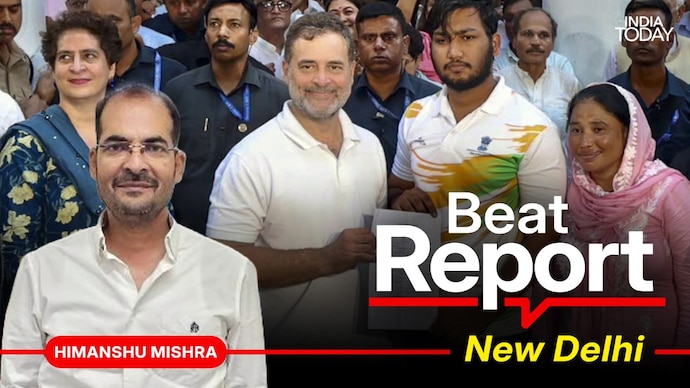 Rahul Gandhi with the FIR copy, accompanied by pellet gun survivor Sahil Lochab and his mother. (Photo: ITG/PTI)