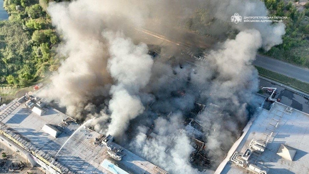 Firefighters work at the site of a shopping mall hit by Russian drone strikes in Ukraine's Kryvyi Rih. (Photo: Ukrainian military authorities via Reuters) Ukraine mall attack