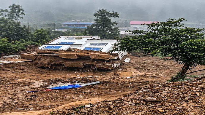 A house was destroyed in the landslide in Nepal, where floods and landslides have killed 24 people and injured 14