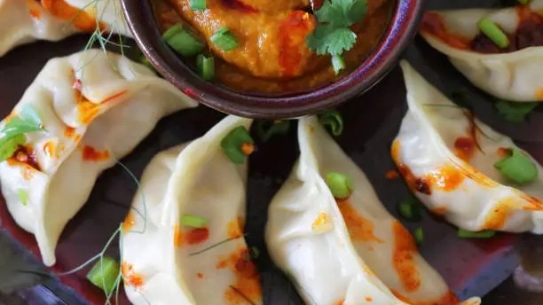 A squash momo is a dumpling stuffed with squash, a vegetable that has long been part of home-style cooking across Himalayan communities. (Photo: Unsplash) Squash momo