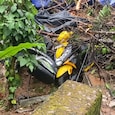 A woman was killed after a landslide fell on her scooter. A woman was killed after a landslide fell on her scooter.