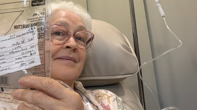Nafisa Ali shared a hospital photo, smiling while holding an IV drip bag. (Credit: Instagram/nafisaalisodhi) Actor Nafisa Ali’s Stage 4 ovarian cancer spreads to liver, targeted therapy begins