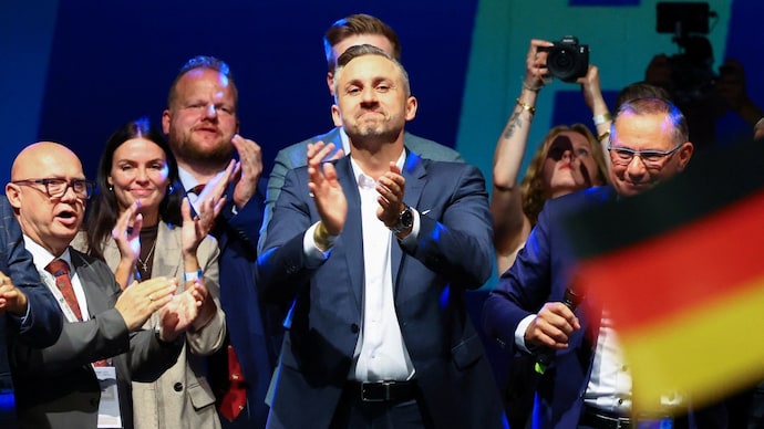 Top candidate of the far-right Alternative for Germany (AfD) Ulrich Siegmund applauds onstage at the AfD election party in Magdeburg. Top candidate of the far-right Alternative for Germany (AfD) Ulrich Siegmund applauds onstage at the AfD election party in Magdeburg.
