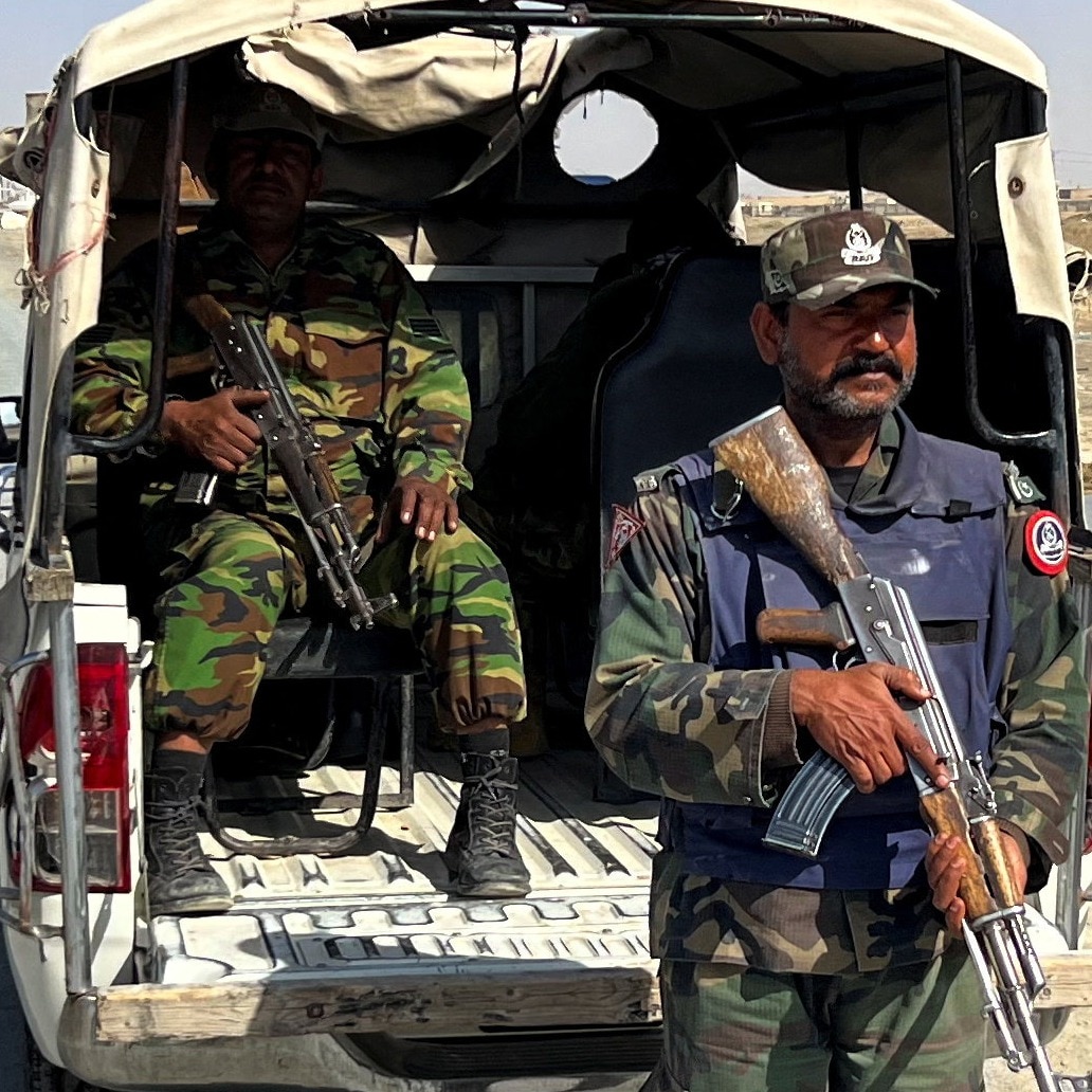 Members of the Balochistan Constabulary police force guard a road leading to the Chaman Border Terminal