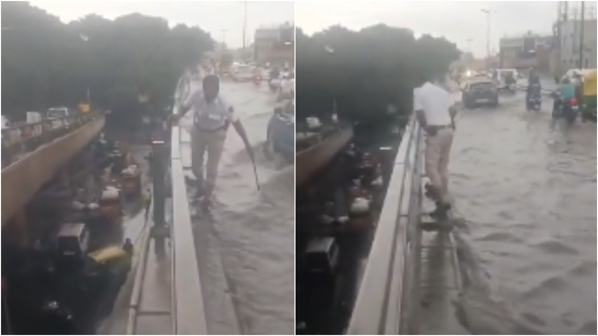Bengaluru traffic cop clears drain on flooded flyover as vehicles struggle to pass
