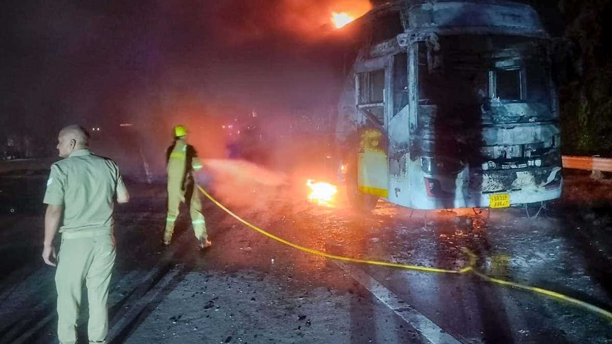 Firefighters at the site after a sleeper bus caught fire on the Yamuna Expressway. (Image: PTI) Firefighters at the site after a sleeper bus caught fire on the Yamuna Expressway