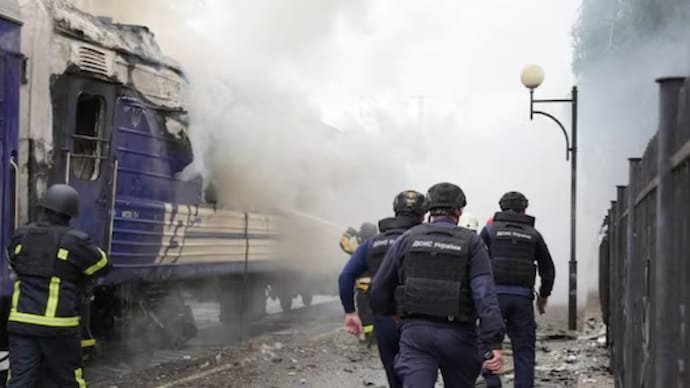 Firefighters extinguish the flames of a passenger train carriage hit by a Russian drone attack at a railway station, as part of Russia's offensive against Ukraine, in Lutsk, Ukraine. (Reuters) Firefighters extinguish the flames of a passenger train carriage hit by a Russian drone attack at a railway station, as part of Russia's offensive against Ukraine, in Lutsk, Ukraine. (Reuters)
