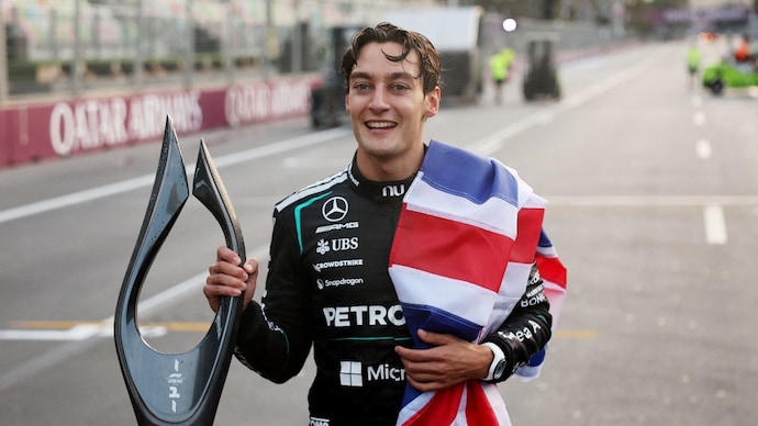 George Russell celebrates winning the Azerbaijan GP. (Image: Reuters) George Russell