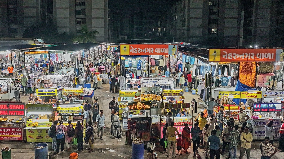MANY QUESTIONS: A night bazaar in Ahmedabad (Photo: Mayur Bhatt)