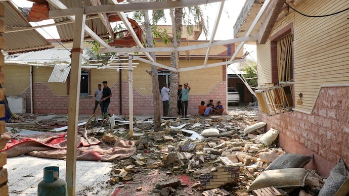 Rubble lies around damaged houses following a reported attack near a wedding gathering in Kuhistik, Sirik, Iran. (Photo- Reuters)