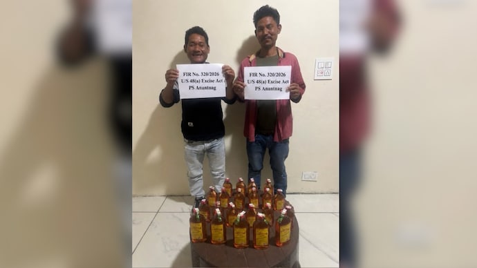 Jammu and Kashmir cops arrest 2 men in liquor case, their smiling mugshots go viral (Photos: @AnantnagPolice/X) Jammu and Kashmir cops arrest 2 men in liquor case, their smiling mugshots go viral