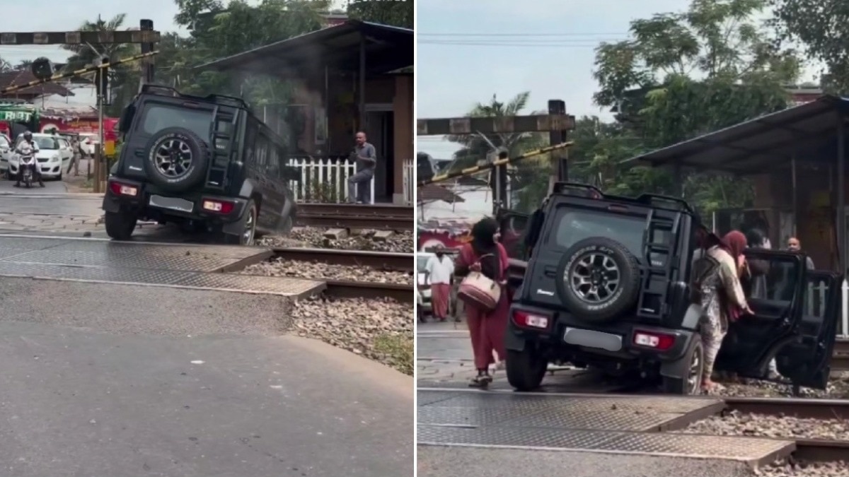 Kerala driver struggles to free car stuck on railway track, abandons it as train nears