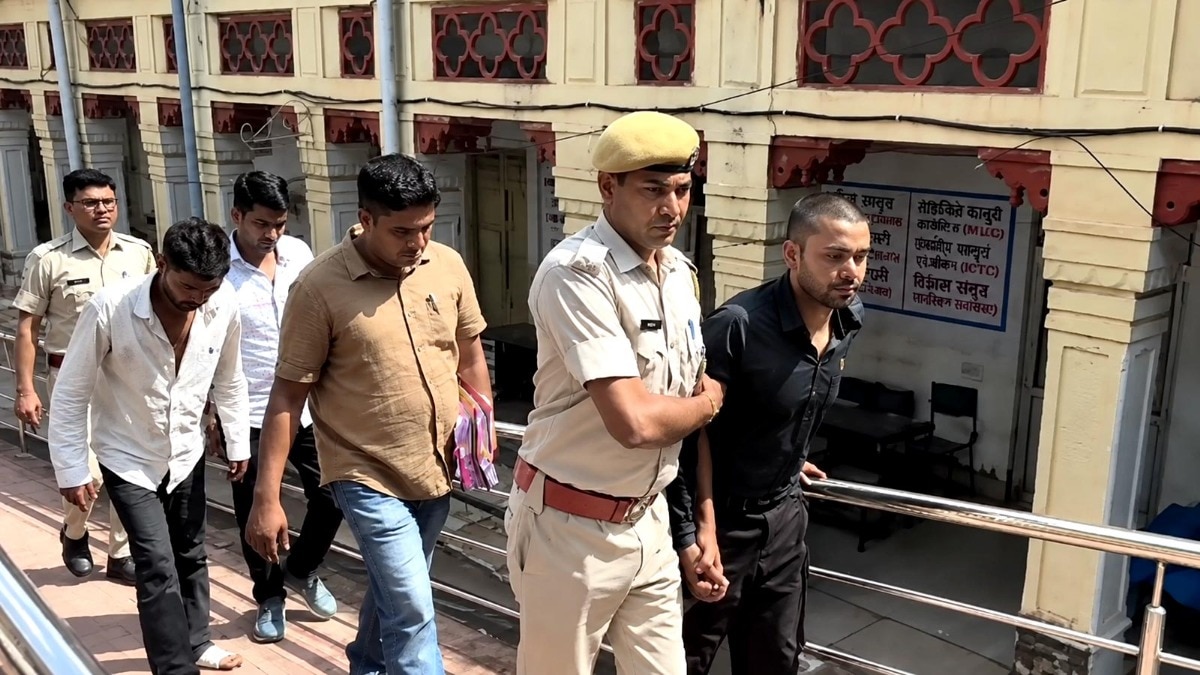 Triple murder accused limp into court after police cut their hair, parade them