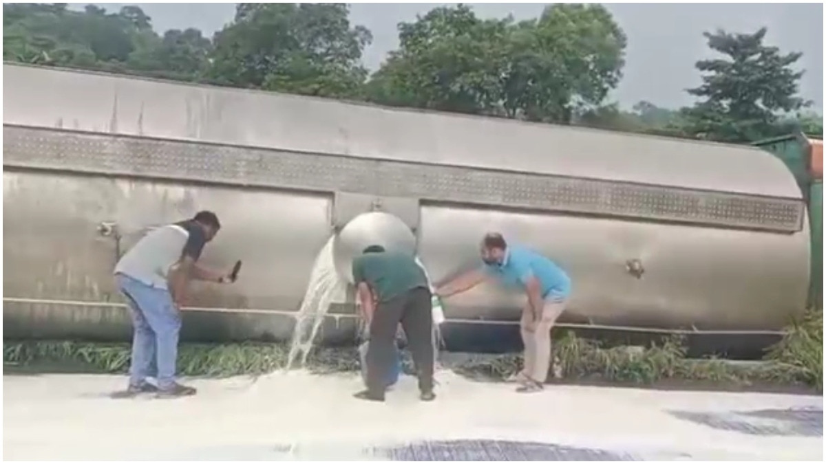Locals rush with bottles to collect milk as tanker overturns on Maharashtra highway