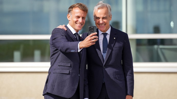 France's President Emmanuel Macron and Canada's Prime Minister Mark Carney pose for a selfie as they meet in the small French territory of Saint Pierre and Miquelon, France. ( Photo- Reuters)