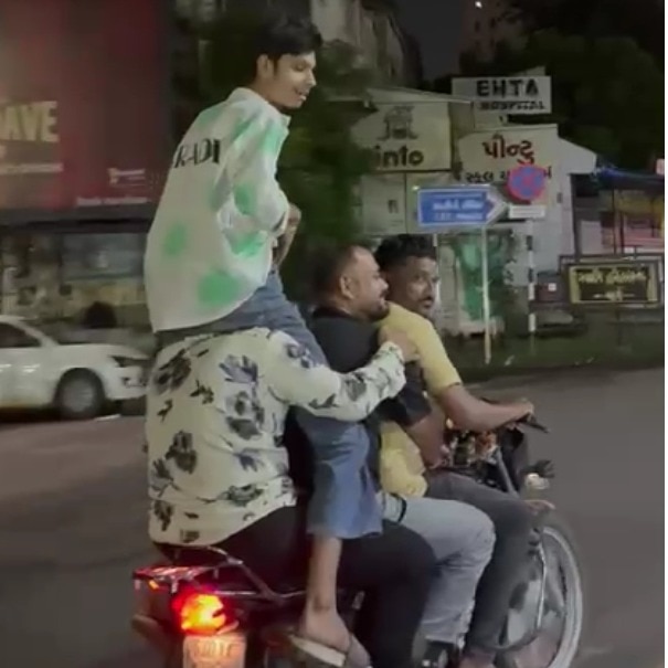 Ahmedabad man sits on friend’s shoulders as 4 men squeeze onto one bike, get arrested