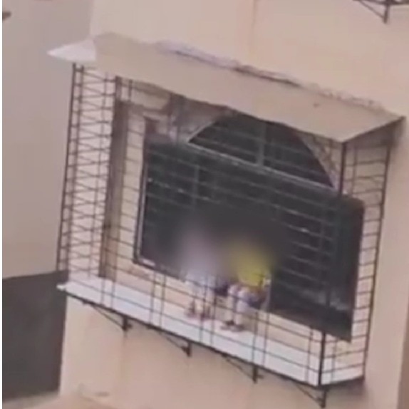 Man warns kids sitting on window ledge of 9th-floor flat, their mother confronts him