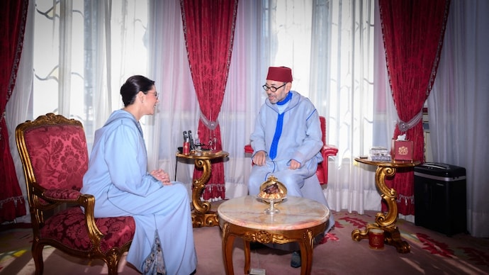Morocco's King Mohammed VI receives Fatima Ezzahra El Mansouri, who was appointed Morocco's first woman prime minister. (Moroccan Royal Palace/Handout via REUTERS)