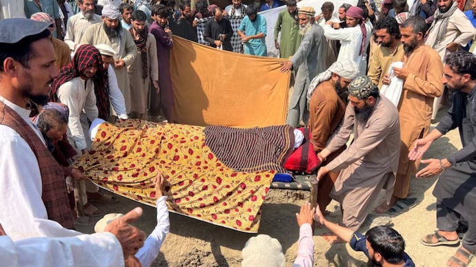 People move the bodies of victims killed in Pakistani airstrike, before their burial in Kunar province, Afghanistan. (Photo: Reuters)