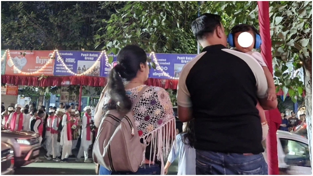 Pune parents put headphones on baby at dhol-tasha procession to block loud noise