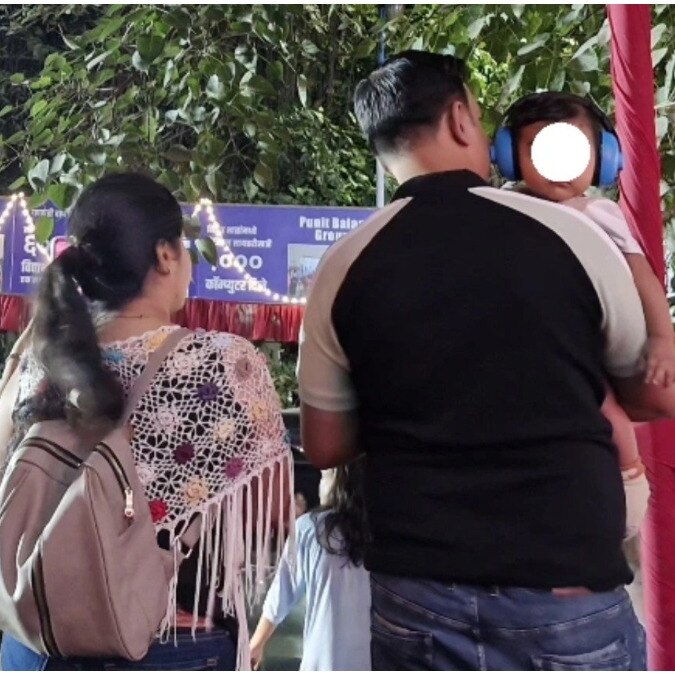 Pune parents put headphones on baby at dhol-tasha procession to block loud noise