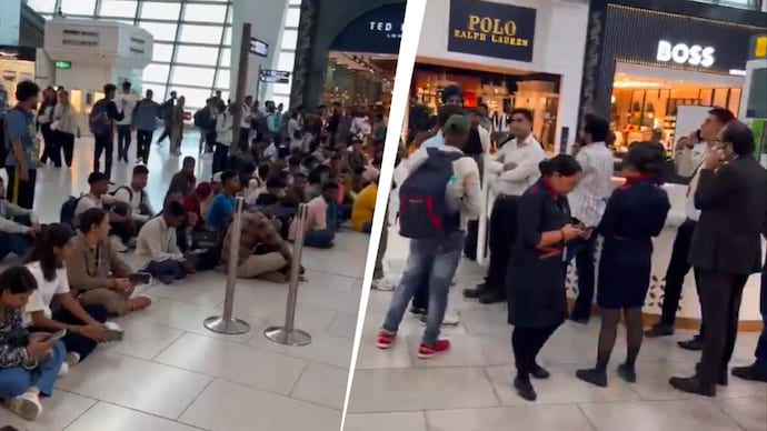 SpiceJet passengers protest against the delay in Delhi-Dubai flights at the IGI Airport in Delhi on Tuesday.