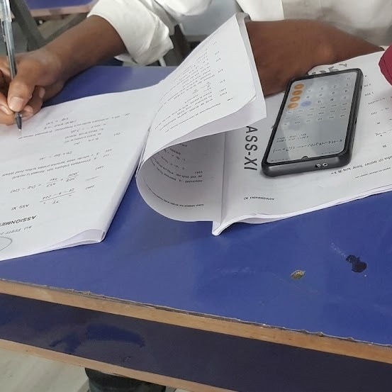 Students were seen using the mobile phones to answer the question paper