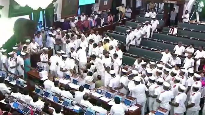 Marshals evict protesting DMK MLAs during their protest in Tamil Nadu Assembly demanding the expunging of CM Vijay's corruption references against the party on Tuesday.