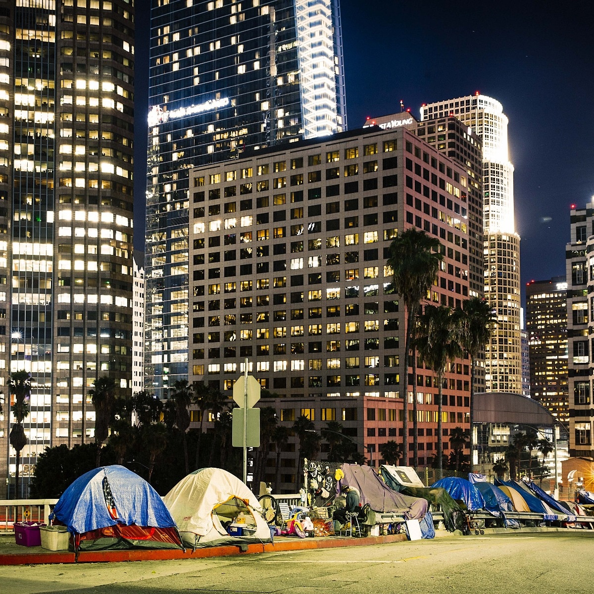 Tents sheltering homeless people contrast with Los Angeles’ glittering skyline. California accounts for nearly 30% of America’s homeless population. (Image: Getty Images)