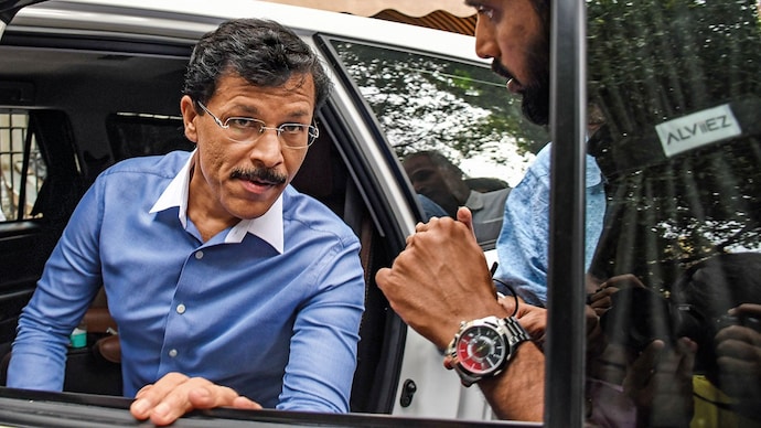 THE ENFORCER: Mundhe after a press conference in Mumbai, Aug. 26; below, some of the kitchens found wanting in FDA crackdowns. (Photo: Getty Images)