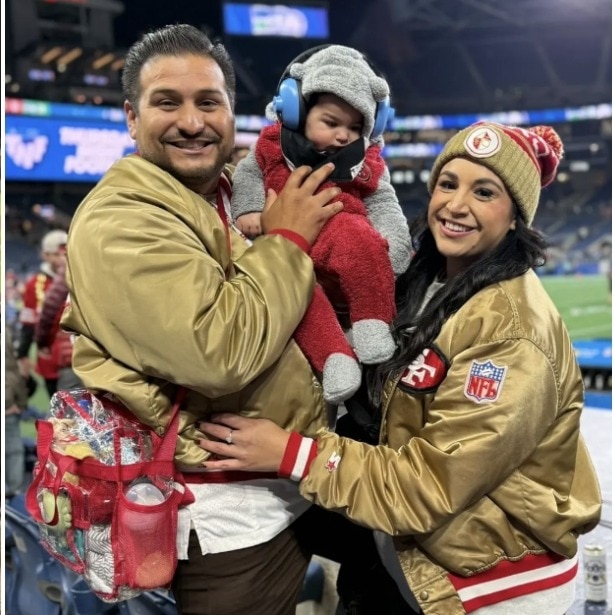 US woman filmed carrying baby, 3 plates of food at game breaks silence on viral clip