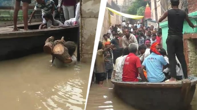 Varanasi floods: Ganga swells towards danger mark, Manikarnika Ghat submerged as people struggle (Photos: ITG)